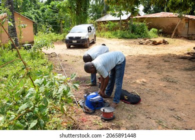 Abuja, Nigeria - October 28, 2021: African Geologist And Team Members Conducting Geophysical Survey For Water Availability In The Ground. Soil Science And Test. Rural Water Project.