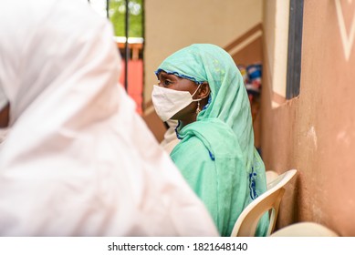 Abuja, Nigeria: Profile Image Of A Woman Wearing A Nose Mask As She Awaits Her Palliative. Taken On August 16, 2020.