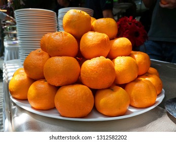 An Abundance Of Clementine (Citrus Clementina) In A Round White Plate. 
