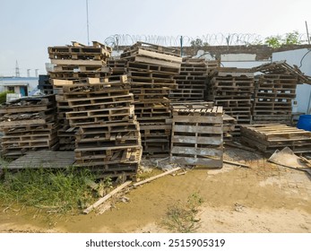 
Abundant broken wooden pallets in a factory scrapyard showcase weathered textures and industrial charm. Ideal for eco-friendly, upcycling, and industrial-themed designs. Perfect for sustainability. - Powered by Shutterstock