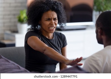 Abused angry scared african wife victim shows stop enough violence hand gesture, unhappy black woman afraid of fight with husband feels desperate about aggression, bad relationships, family conflict