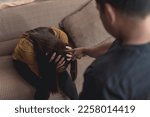 An abusive and manipulative husband points at his emotionally battered wife, making threats and insults. Example of emotional and verbal abuse, or gaslighting.