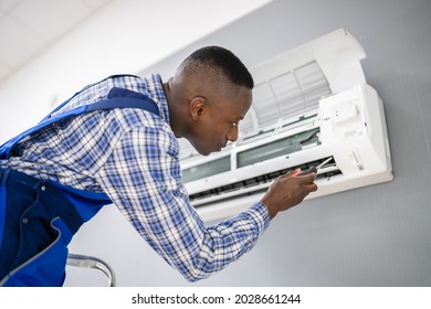 AC Electrician Technician Repairing Air Conditioner Appliance