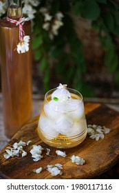 Acacia Flowers Syrup In A Glass With Cold Iced Water