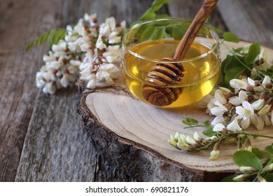 Acacia Honey And Flowering Acacia On Wooden Table