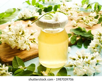 Acacia Syrup Homemade Honey With Flowers On Wood. Shallow Dof.