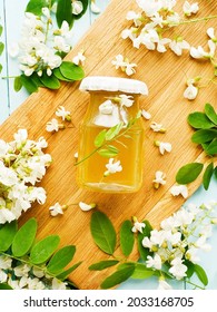 Acacia Syrup Homemade Honey With Flowers On Wood. Shallow Dof.