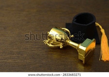 Academic Failure and Educational Setback with Fallen Trophy and Graduation Cap