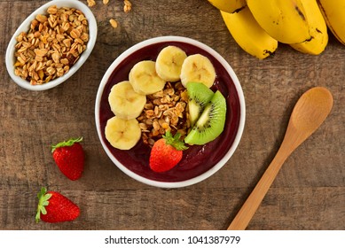 Acai berry bowl with sliced fruits on top - Powered by Shutterstock