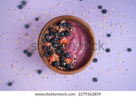 Acai bowl with blueberries and strawberries.



