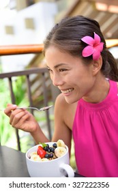 Acai Bowl - Girl Eating Healthy Food Outdoors. Woman Enjoying Acai Bowls Made From Acai Berries And Fruits Outdoors For Breakfast.