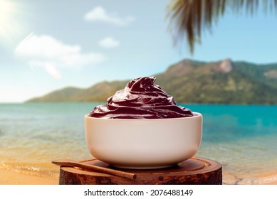 Acai Bowl With Lens Flare On Tropical Beach