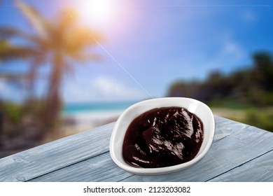 Acai Bowl With Lens Flare On Tropical Beach Background