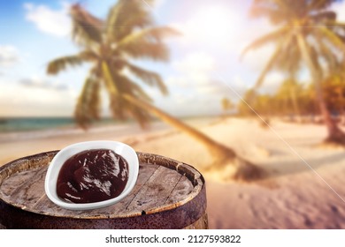 Acai Bowl With Lens Flare On Tropical Beach Background