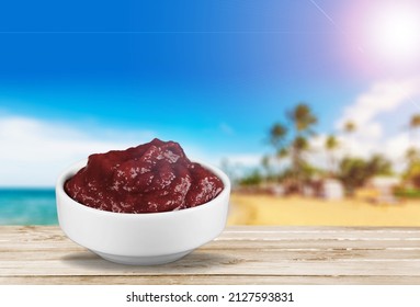 Acai Bowl With Lens Flare On Tropical Beach Background