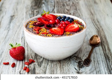 Acai Breakfast Superfoods Smoothies Bowl With Chia Seeds, Bee Pollen, Goji Berry Toppings And Peanut Butter. Overhead, Top View.