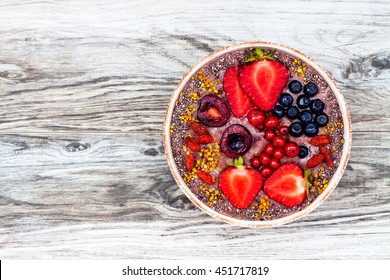 Acai Breakfast Superfoods Smoothies Bowl With Chia Seeds, Bee Pollen, Goji Berry Toppings And Peanut Butter. Overhead, Top View.