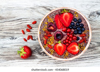 Acai Breakfast Superfoods Smoothies Bowl With Chia Seeds, Bee Pollen, Goji Berry Toppings And Peanut Butter. Overhead, Top View.