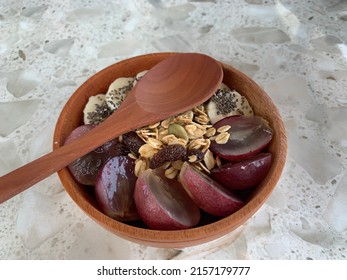 Acai Smoothie Bowl With Berry Yoghurt, Grape, Banana, And Almont Crumbs On Wooden Bowl