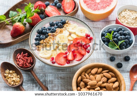 Acai Smoothie bowl with granola, banana, strawberry and blueberries. Superfood. Concept of healthy eating, healthy lifestyle