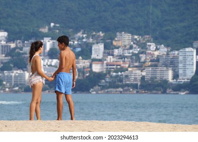Acapulco, August 16 2017: Woman in bikini sunbathing on Mexican beach on vacation in summer