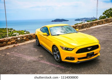 Acapulco, Mexico - May 31, 2017: Yellow Muscle Car Ford Mustang In The City Street.