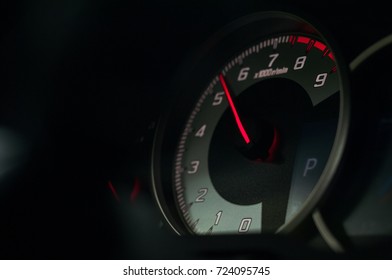 Accelerating car. Throttle goes up in the tachometer.