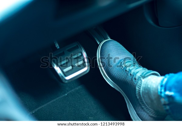 accelerator and breaking\
pedal in a car
