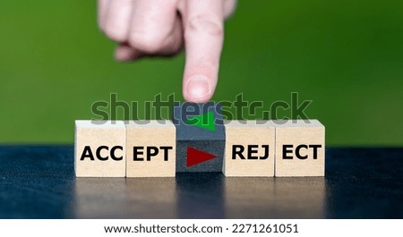 Accept or reject? Hand turns cube and changes the orientation of an arrow as symbol to accept a proposal.