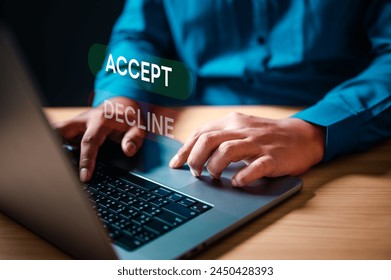 accept, strategy, approve, typing, value, information, diagnosis, development, security, analysis. A man is typing on a laptop with the words accept and decline displayed on the screen.