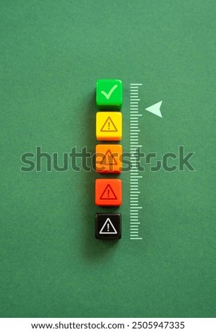 Acceptable level. Scale with warnings. Security. On the verge of moving from green to yellow alert level. Safety system.