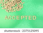 Accepted in wooden English language capital letters spelling positive opinion spilling from a pile of letters pencil sketch