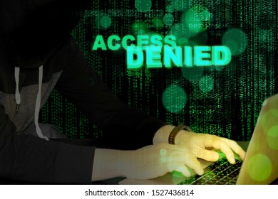 Access denied - hacker and laptop with code background