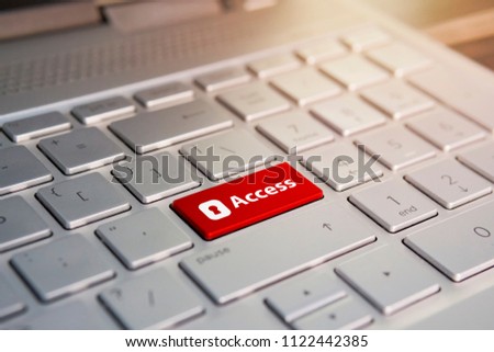 access enter key and keys icon. Color button on the gray silver keyboard of modern ultrabook. caption on the button