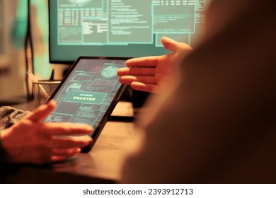 Access granted message on digital tablet, successful database hacking, criminal cracking password. Cyberattack, internet thieves stealing electronic information, using malicious software