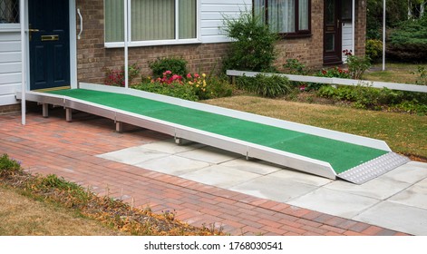 A access ramp installed at the door to a building so that a disabled person can access it - Shutterstock ID 1768030541