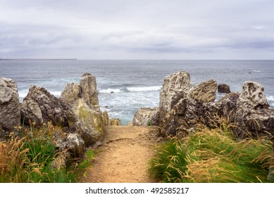 access road to the beach between the rocks