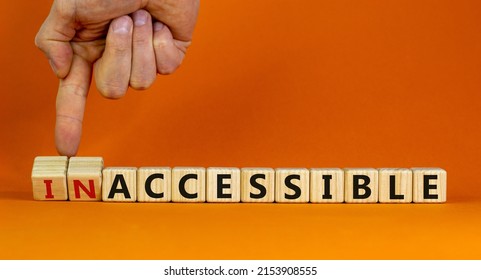 Accessible or inaccessible symbol. Businessman turns wooden cubes, changes the word Inaccessible to Accessible. Beautiful orange background, copy space. Business, accessible or inaccessible concept.