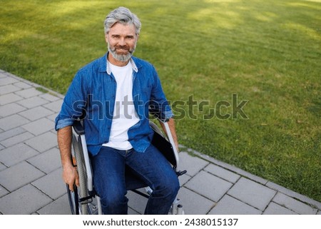 Similar – Image, Stock Photo Joyful wheelchair user with assistant enjoying outdoors