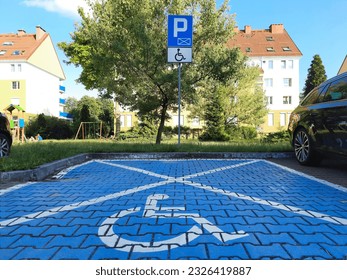 Accessible Parking. Road sign Parking only for disabled drivers. Parking space for disabled individuals, indicated by road markings and information sign. Adapted spaces for disabled person. Inclusion.