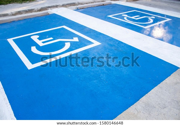 Accessible parking for wheelchair user on the road\
in town.