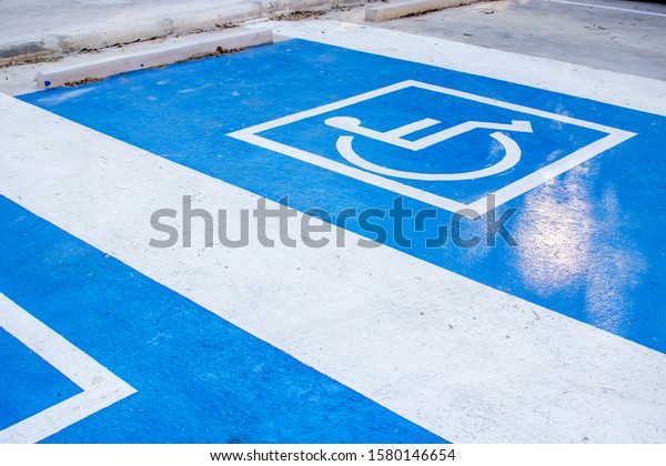 Accessible parking for wheelchair user on the road\
in town.