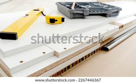 accessories for assembling furniture on disassembled furniture. High quality photo