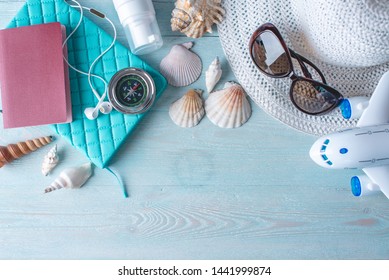 Accessories For A Bright Summer Sunny Holiday In The Resort. Items For Travel To The Sea Laid Out On A Wooden Table. Top View