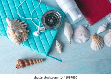 Accessories For A Bright Summer Sunny Holiday In The Resort. Items For Travel To The Sea Laid Out On A Wooden Table. Top View