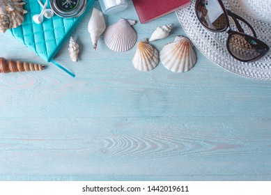 Accessories For A Bright Summer Sunny Holiday In The Resort. Items For Travel To The Sea Laid Out On A Wooden Table. Top View