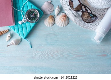 Accessories For A Bright Summer Sunny Holiday In The Resort. Items For Travel To The Sea Laid Out On A Wooden Table. Top View