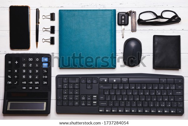 Accessories organized on\
table in knolling arrangement. Business knolling, home office flat\
lay. Workspace desk styled design office supplies. Creative\
minimalist.\
Freelance.