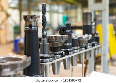 Accessories And Tools For A CNC Machine On A Rack For Equipment At A Factory And Enterprise.