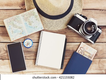 Accessories For Travel. Passport, Photo Camera, Smart Phone And Travel Map. Top View. Holidays And Tourism Concept